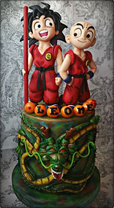 a cake with two figurines on top of it