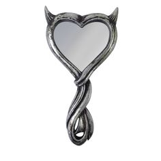 a heart shaped mirror hanging from the side of a metal wall mounted hook on a white background