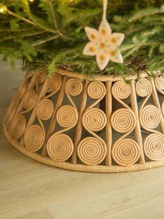 a close up of a christmas tree in a basket