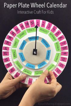 paper plate wheel calendar for kids with numbers on it and hands holding up the clock