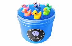 there are many small rubber ducks in a blue tub with water inside it and on the bottom