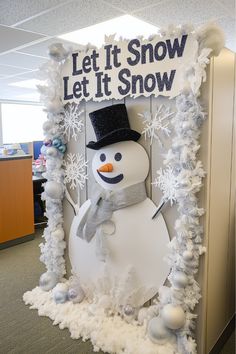 A cheerful snowman is a delightful addition to your cubicle Christmas decorations. Imagine building a foam snowman with a cozy scarf and festive hat right on your cubicle wall—it’s fun and full of personality. What accessories would you add to make it stand out even more? Christmas Decorations For Work Cubicle, Winter Themed Office Decorations, Let It Snow Cubicle Decorations, Call Center Christmas Decorations, Christmas Cubicle Themes, Office Snowman Decorations, Winter Decor Classroom, Snowman Office Decorations, Simple Office Christmas Decorations