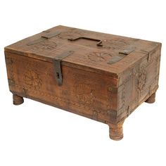 an old wooden box sitting on top of a table