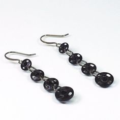 Hey, I found this really awesome Etsy listing at https://www.etsy.com/listing/399880525/black-sewing-earrings-upcycled-black Sewing Earrings, Object Earrings, Sewing Jewelry, Guitar String Bracelet, Found Object Jewelry, Paper Bead Jewelry, Music Jewelry, Repurposed Jewelry, Paper Jewelry