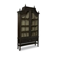 an antique china cabinet with glass doors on the front and bottom shelves, in dark wood