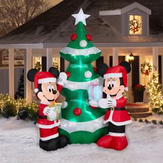 an inflatable mickey and minnie mouse christmas tree