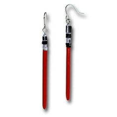 pair of red and silver earrings with black accents on the ends, hanging from hooks