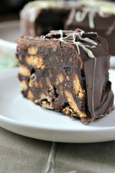 a piece of chocolate cake sitting on top of a white plate