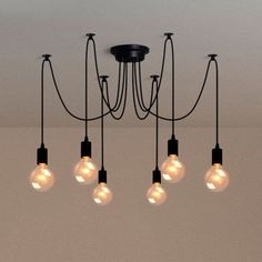 a chandelier with five light bulbs hanging from it's center and four lights on each side