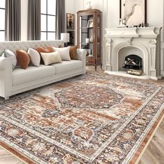 a living room filled with furniture and a large rug on top of a hard wood floor