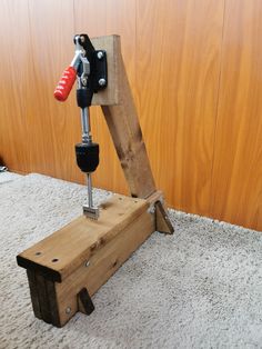 a driller is sitting on top of a piece of wood that has been made into a bench