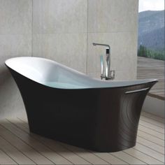 a bath tub sitting on top of a wooden floor