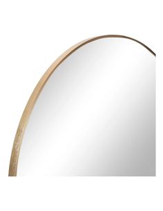 a round mirror with a wooden frame in the middle and an oval shape around it