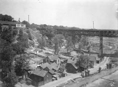 an old black and white photo of a town