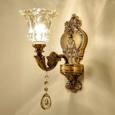 a wall light with a glass shade on it