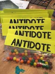 some yellow signs and candy on a table