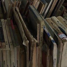 a pile of books sitting next to each other