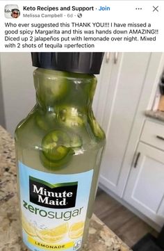 a bottle of lemonade sitting on top of a counter