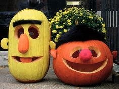 two pumpkins that have faces on them