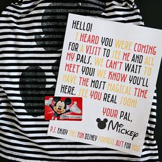 a mickey mouse letter is on top of a black and white striped t - shirt that says, i heard you were coming for virt to see me and all my pals