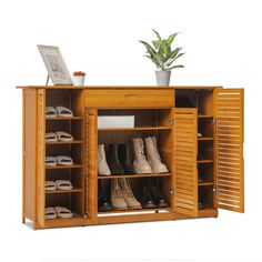 a wooden shoe cabinet with open doors and shoes on the bottom shelf next to it