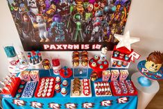 the table is set up with toys for children's birthdays and other decorations