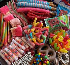 an assortment of candy, candies and pretzels