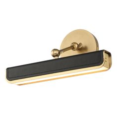 an image of a bathroom light fixture with black and gold trim on the front side