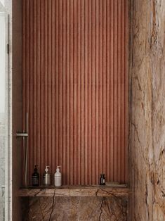 a bathroom with marble counter tops and walls