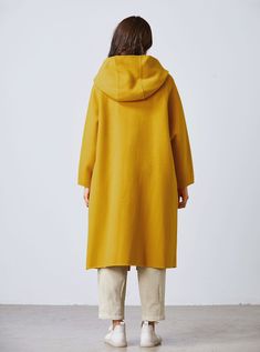 DETAILS: * 50% wool, 50% fiber,nylon * Has no lining * the model is 172 cm high and the model is wearing the coat in XS. * color in the picture show. * A big hood with a long tie at the neck . * No buttons. * Two pockets in seam. * Below knee length. * Dry clean. SIZE & FIT - XS-XL Available - Check the size Chart & instruction with the last photo of this listing - Model Info: Height: 172 cm | Bust: 84 cm | Waist: 64 cm | Hips: 91 cm | Size:XS PERSONALIZATION What I can do - Adjust the s Solid Hooded Cape For Fall, Yellow Oversized Hooded Outerwear, Oversized Wool Cape Coat For Fall, Hooded Wool Cape For Winter, Yellow Wool Outerwear For Winter, Oversized Wool Hooded Outerwear, Mustard Yellow Coat, Long Wool Coat Women, Green Wool Coat