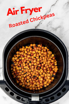 roasted chickpeas in an air fryer on a white marble counter top with the words, air fryer roasted chick peas