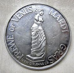 a silver coin with the statue of liberty in it's center and words that read,