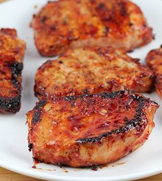 some meat is sitting on a white plate