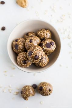 a bowl filled with chocolate chip energy bites