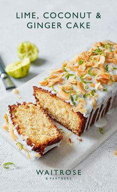 a cake with white frosting and nuts on top