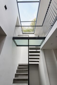 the stairs lead up to the skylight in this modern house