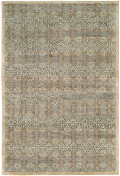 an area rug with many different colors and patterns on it, including blue, brown, beige