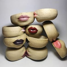 a group of ceramic sculptures made to look like they are hugging