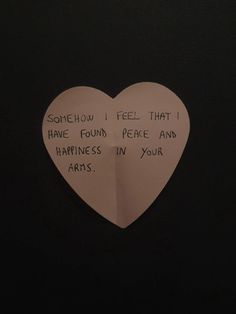 a paper heart with some writing on it