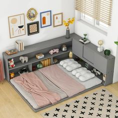 a bedroom with a bed, dresser and rugs on the floor in front of it