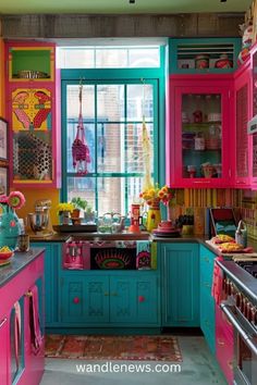 the kitchen is painted bright pink, blue and green with lots of colorful accessories on it