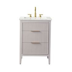 a bathroom vanity with two sinks and gold faucets on the top, against a white background