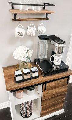 a coffee bar with cups and mugs on it