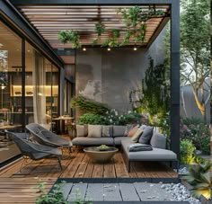 an outdoor living area with furniture and plants