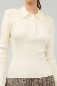 Introducing our Ivory Long Sleeve Top, a modern twist on a classic polo sweater. This soft and cozy knit features a tidy collar with playful ruffle detailing. Complete with a button placket and long sleeves, it's the perfect combination of sophistication and comfort. polo collar ruffle trim button placket long sleeves ribbed true to size model is wearing a small - Model Stats: 72% viscose 28% polyester hand wash cold Curvy Date Night Outfit, Air Clothes, Valentines Day Dresses, Knit Polo, Valentine's Day Outfit, Polo Sweater, Cozy Knit, Tennis Clothes, Sweater Sale