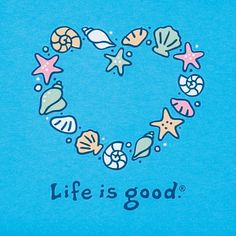 a blue shirt that says life is good with shells and starfish in the shape of a heart