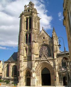 an old church with a clock on the front