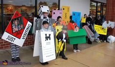 several people dressed up in costumes and holding signs