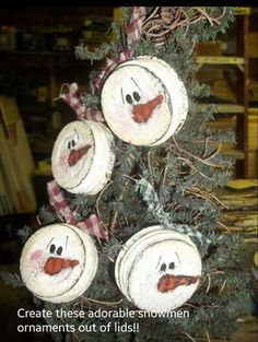 the christmas tree has been decorated with snowmen