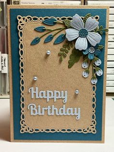 a happy birthday card with flowers on it